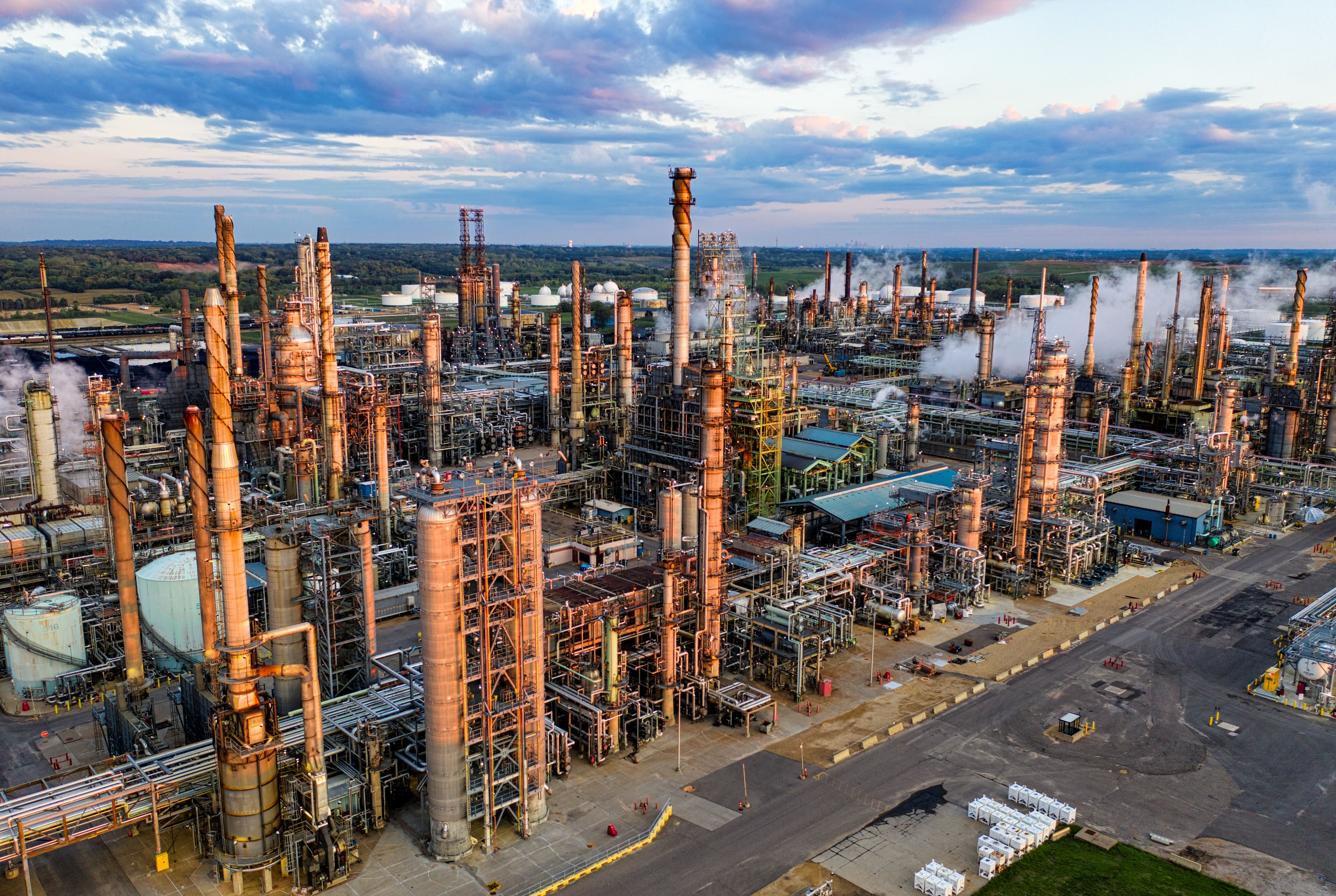 Aerial view of a large petroleum refinery at sunset